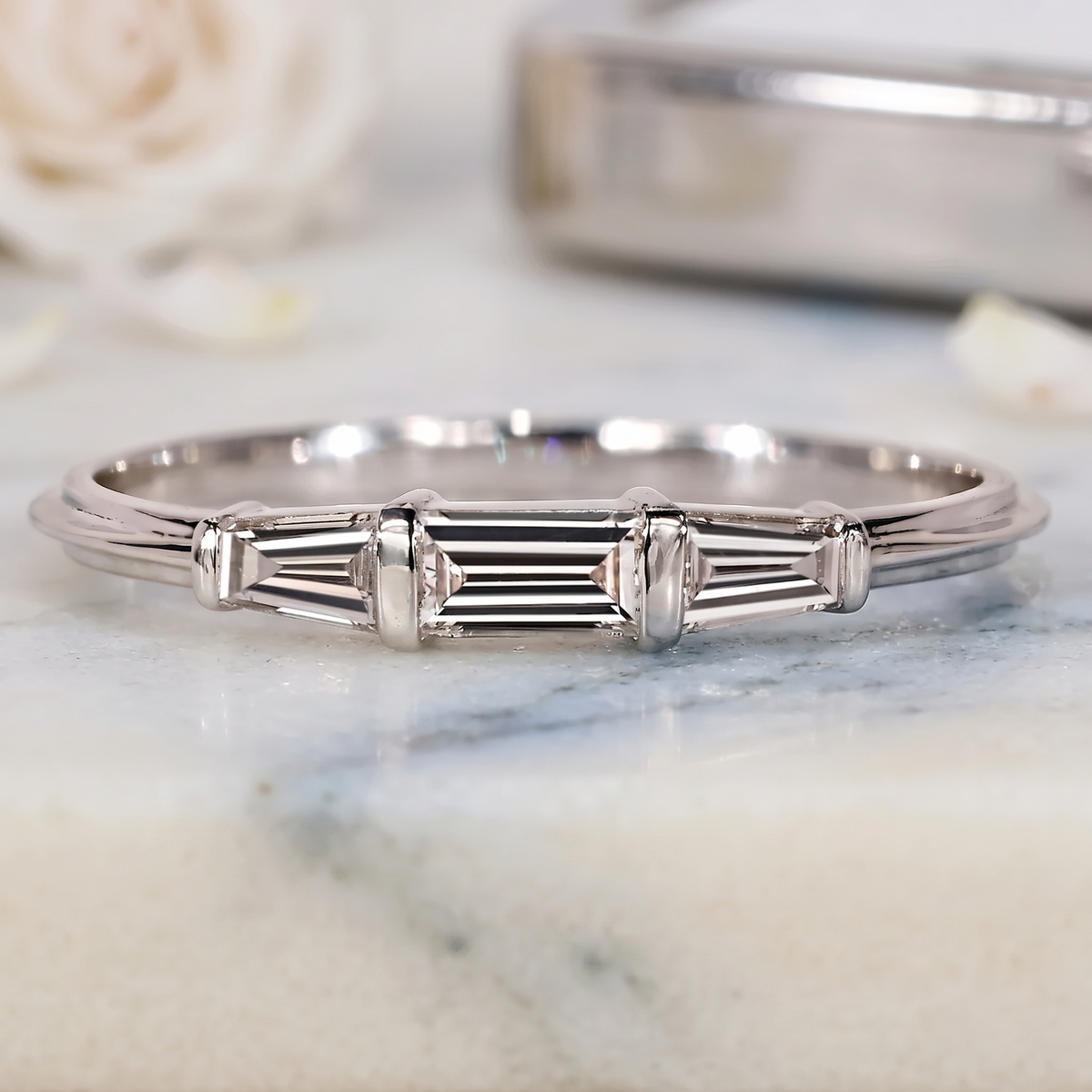 three-stone tapered baguette diamond band in gold