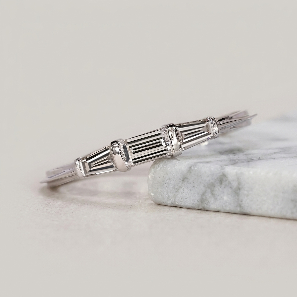 three-stone tapered baguette diamond band in gold