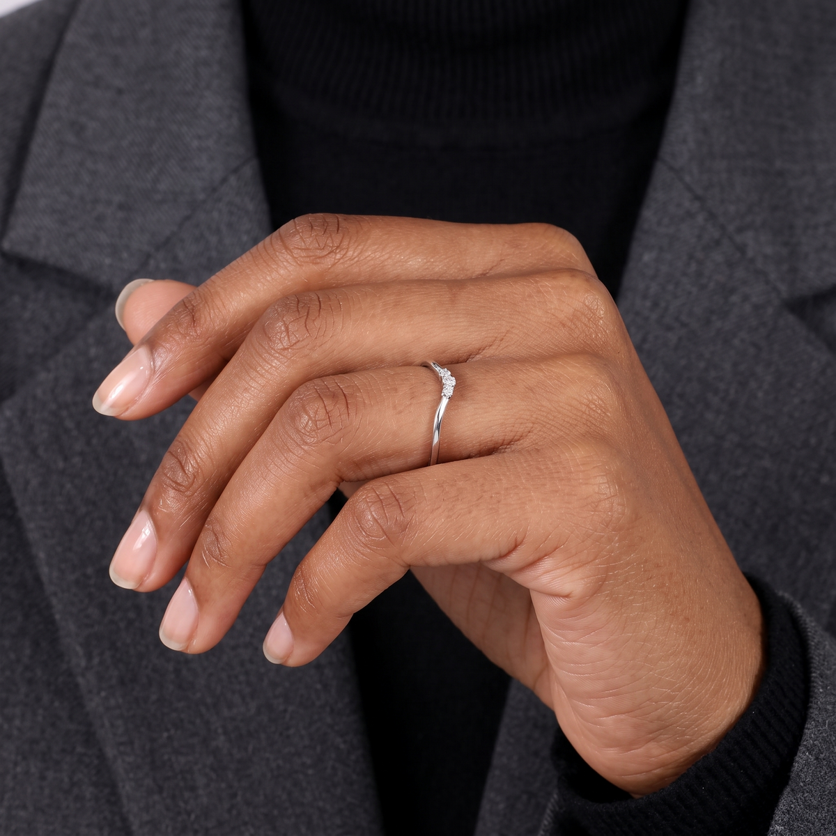 curved three-stone diamond chevron wedding band in gold