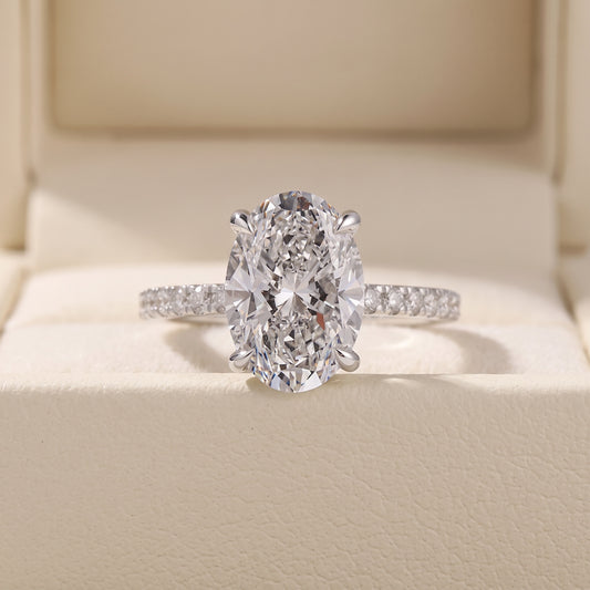 Oval Cut Diamond Engagement Ring with Pave Band and Hidden Halo