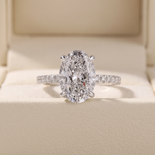 Oval Cut Diamond Engagement Ring with Pave Band and Hidden Halo