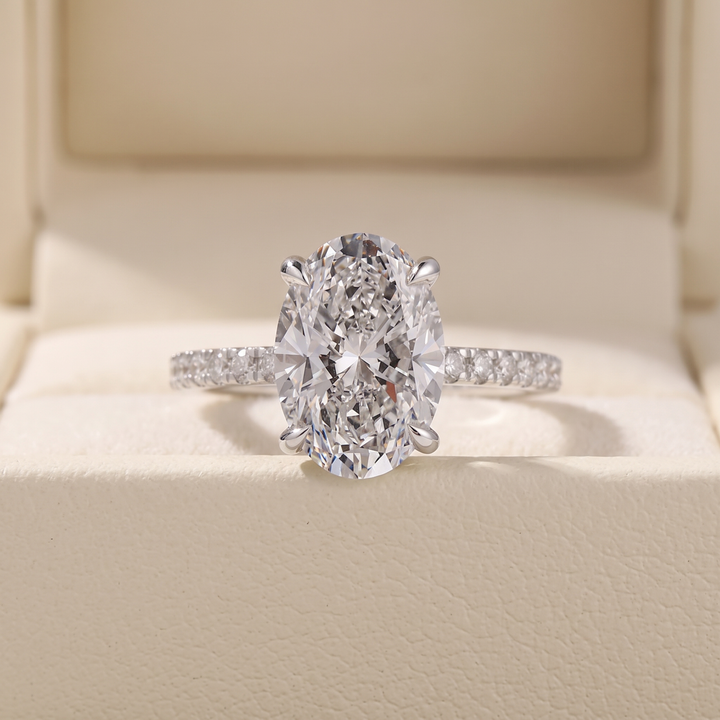 Oval Cut Diamond Engagement Ring with Pave Band and Hidden Halo