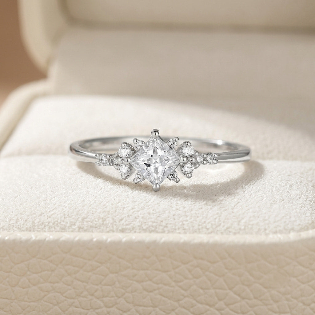 kite cut princess engagement ring with snowflake cluster side accents