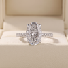 Oval Cut Diamond Engagement Ring with Pave Band and Hidden Halo