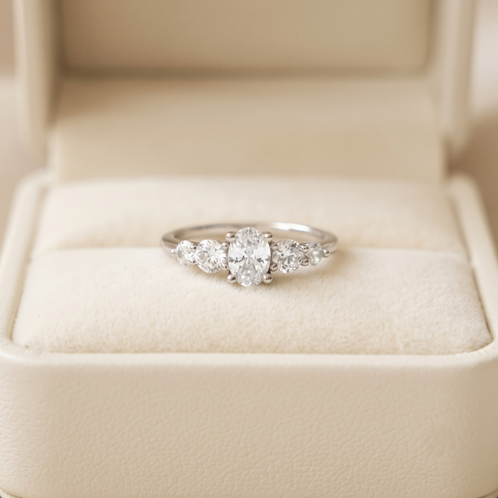 Oval Cut Diamond Five Stone Engagement Ring with Graduated Round Side Accents