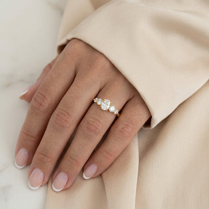 Oval Cut Diamond Five Stone Engagement Ring with Graduated Round Side Accents