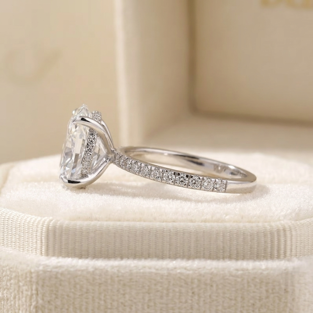 oval cut diamond engagement ring with pave band and hidden halo