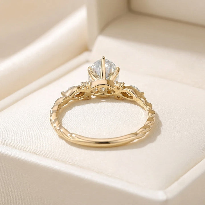 Oval Cut Diamond Engagement Ring with Twisted Band and Marquise Accents