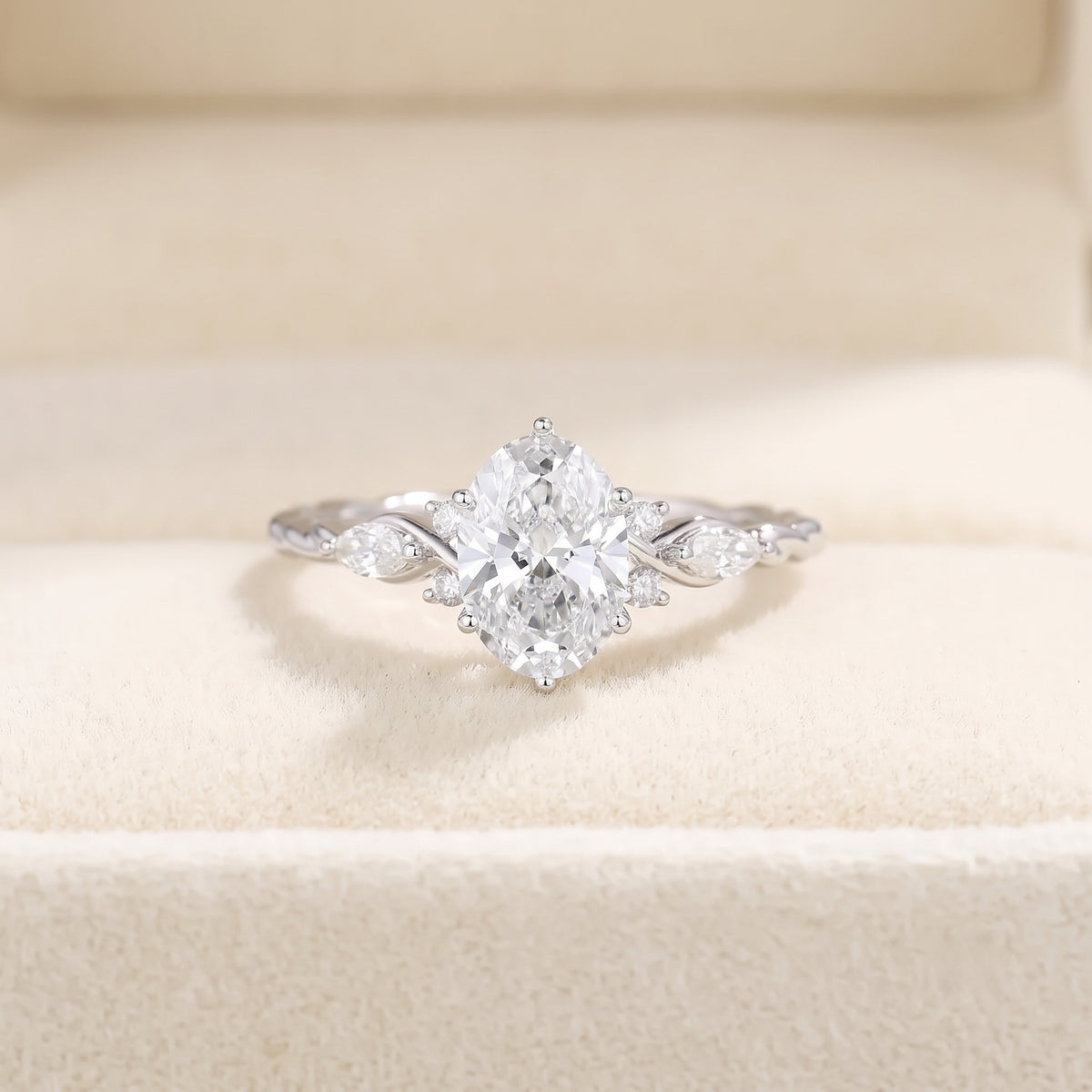 oval cut diamond engagement ring with twisted band and marquise accents