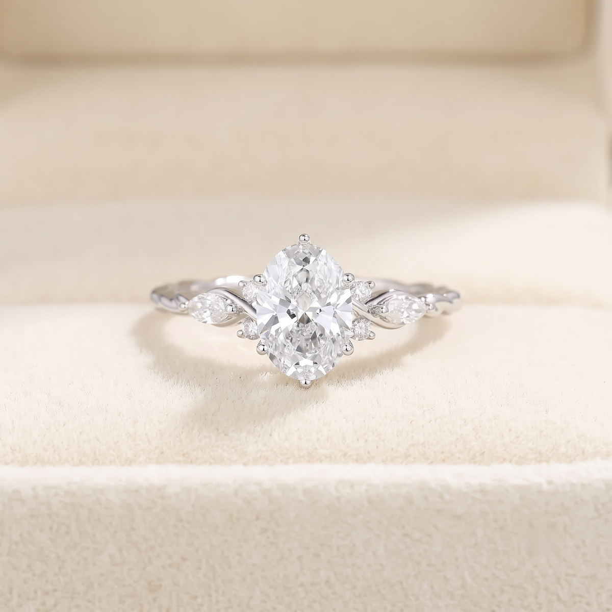 oval cut diamond engagement ring with twisted band and marquise accents