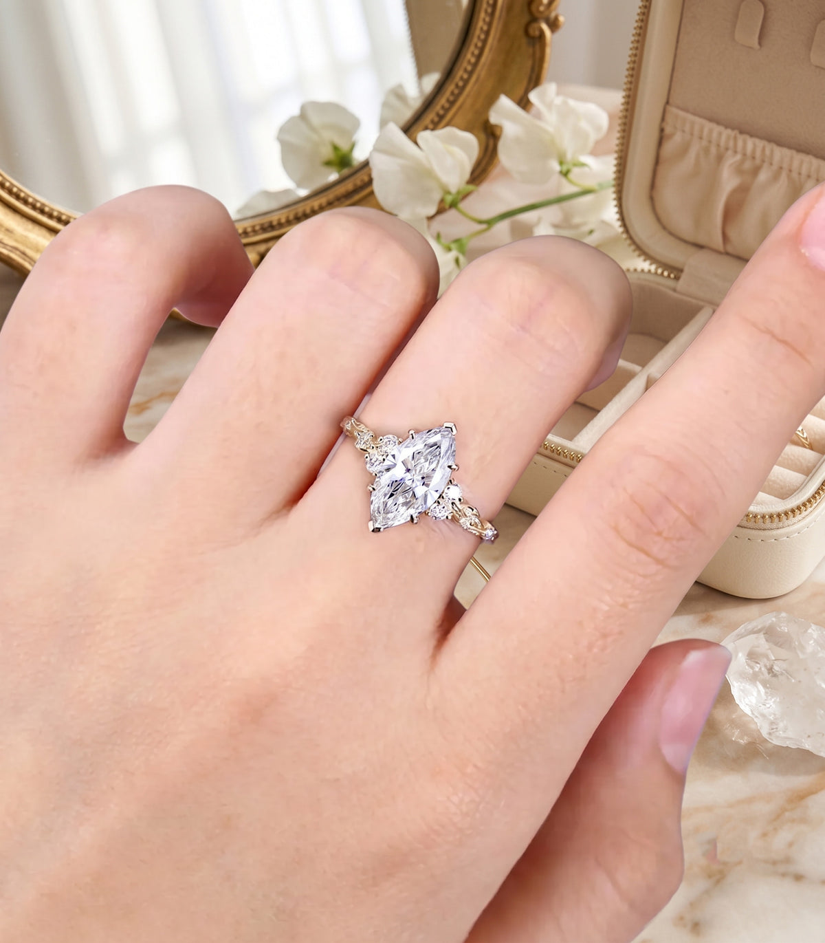 marquise cut diamond engagement ring with leaf vine band and side accents