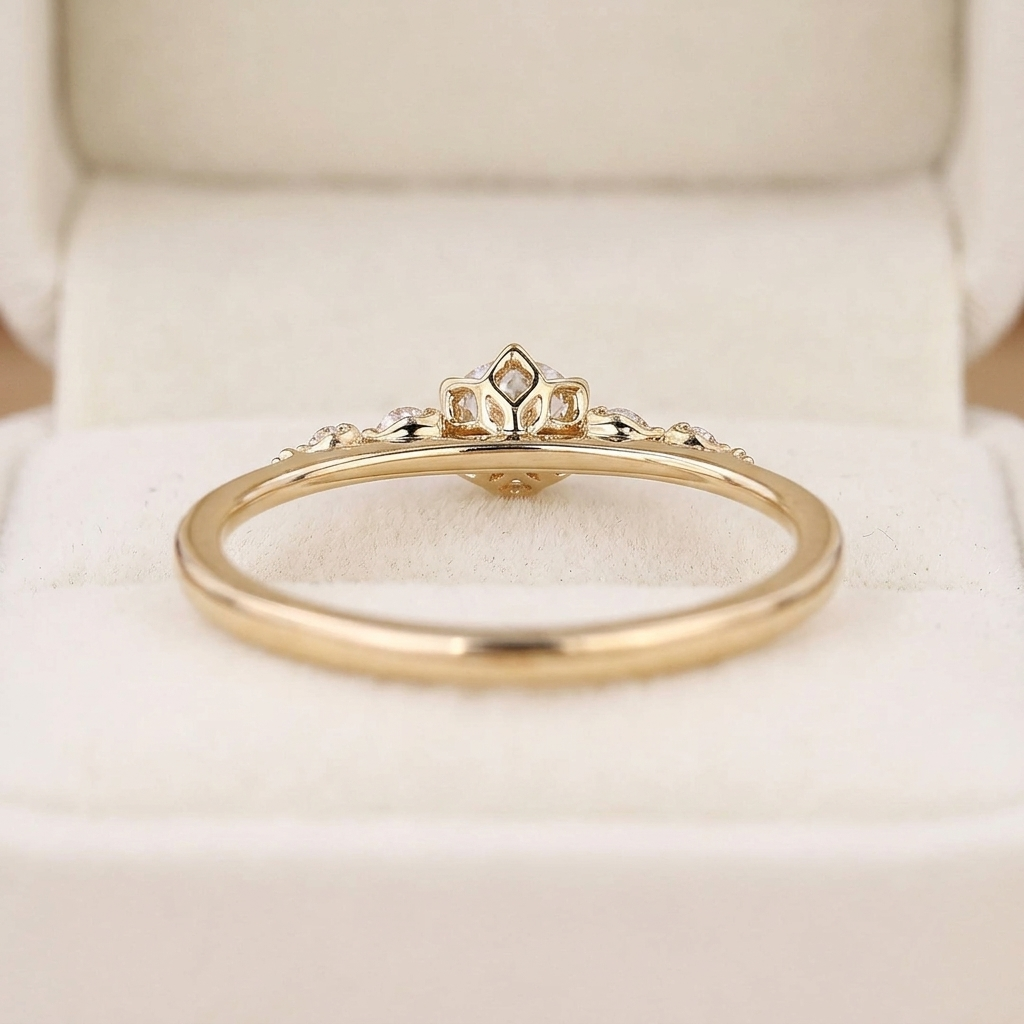 round cut diamond engagement ring with graduated side stones and petal gallery