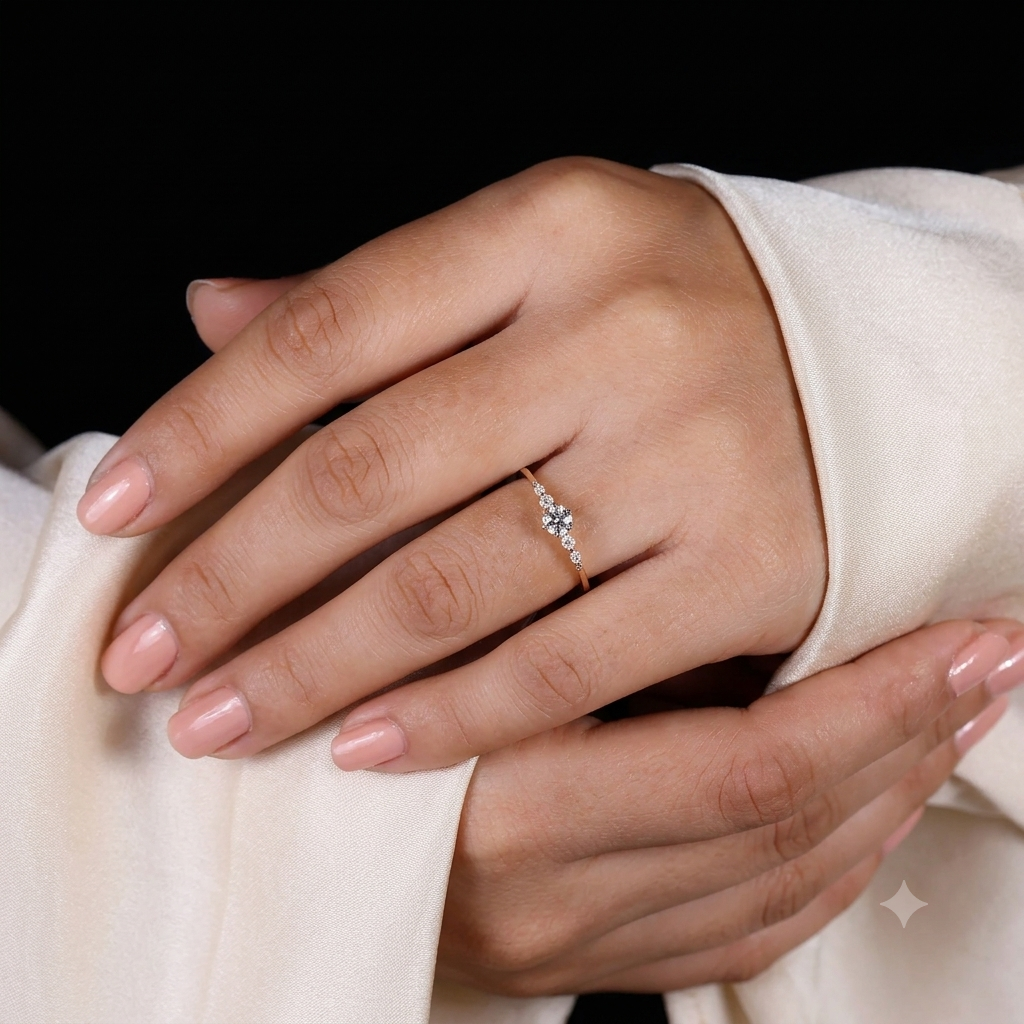 round cut diamond engagement ring with graduated side stones and petal gallery