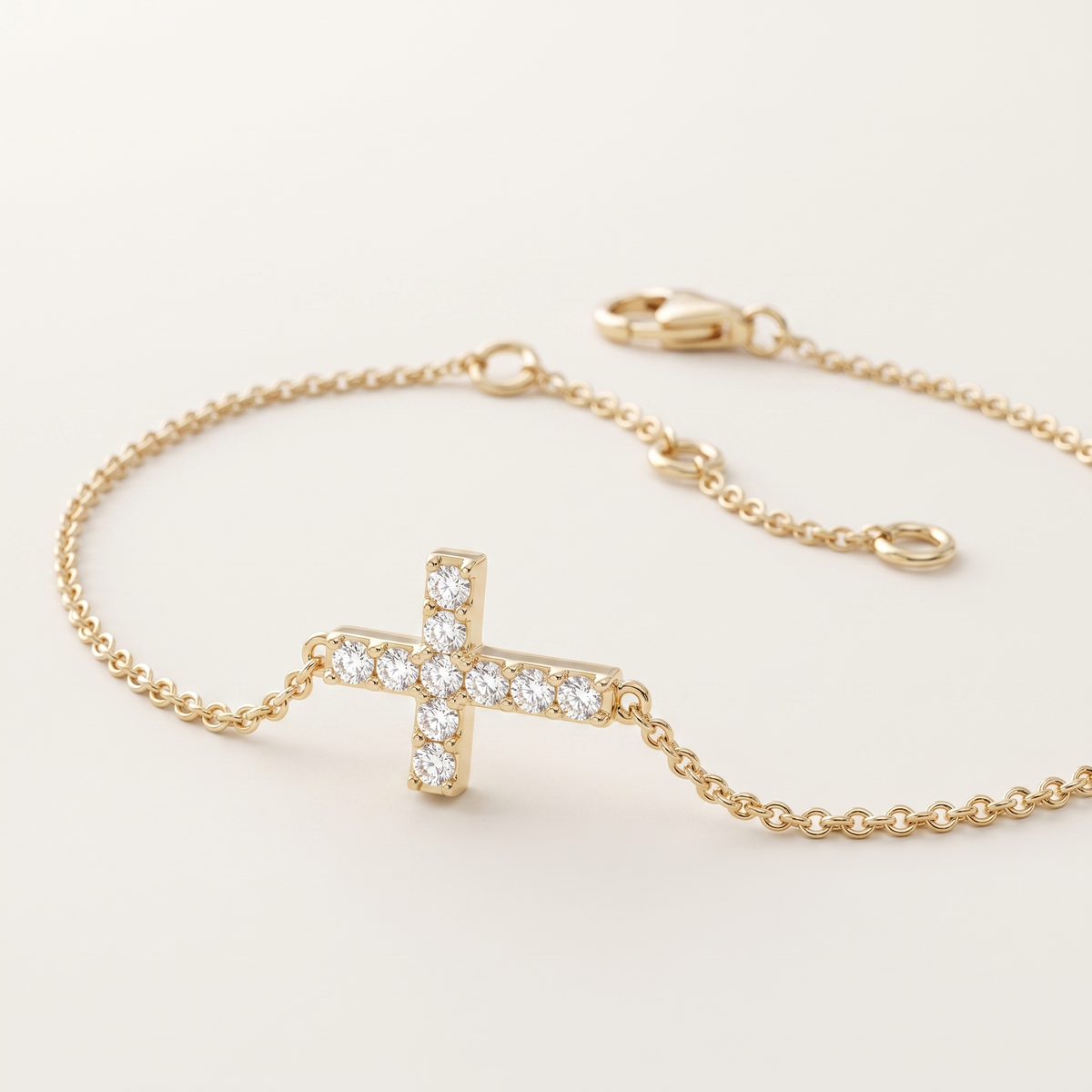 pavé diamond sideways cross chain bracelet in gold