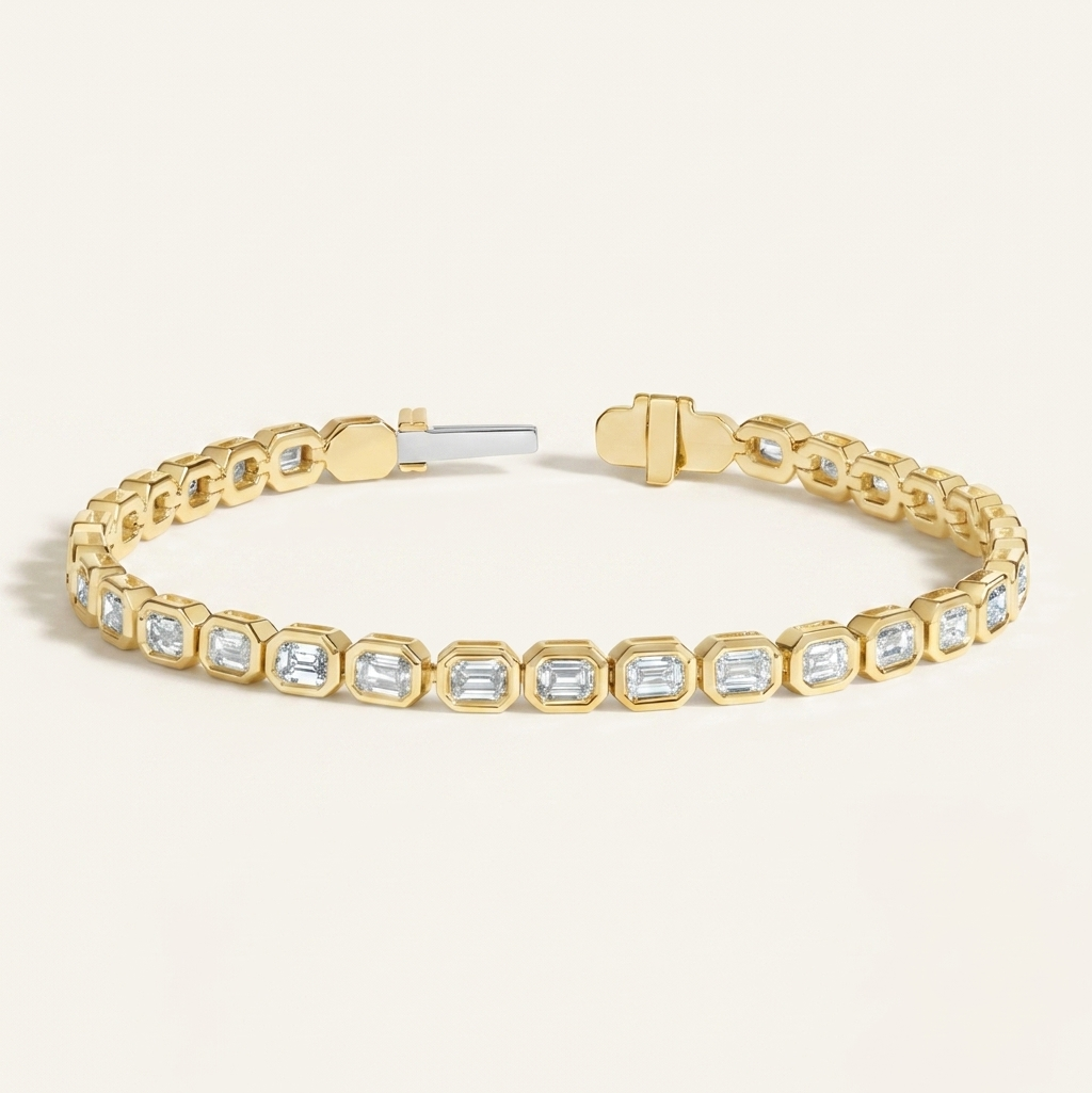 bezel-set emerald cut diamond tennis bracelet in gold