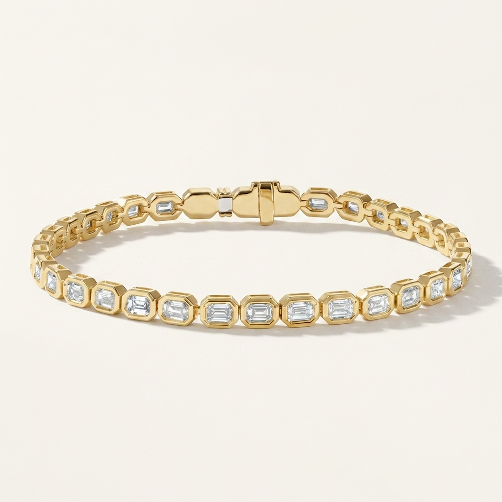 bezel-set emerald cut diamond tennis bracelet in gold