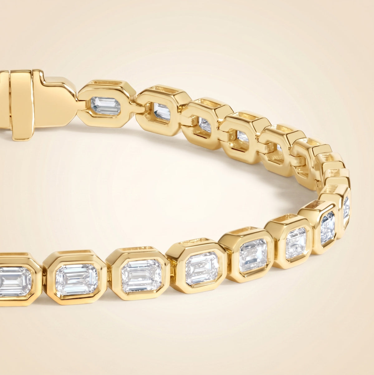 bezel-set emerald cut diamond tennis bracelet in gold