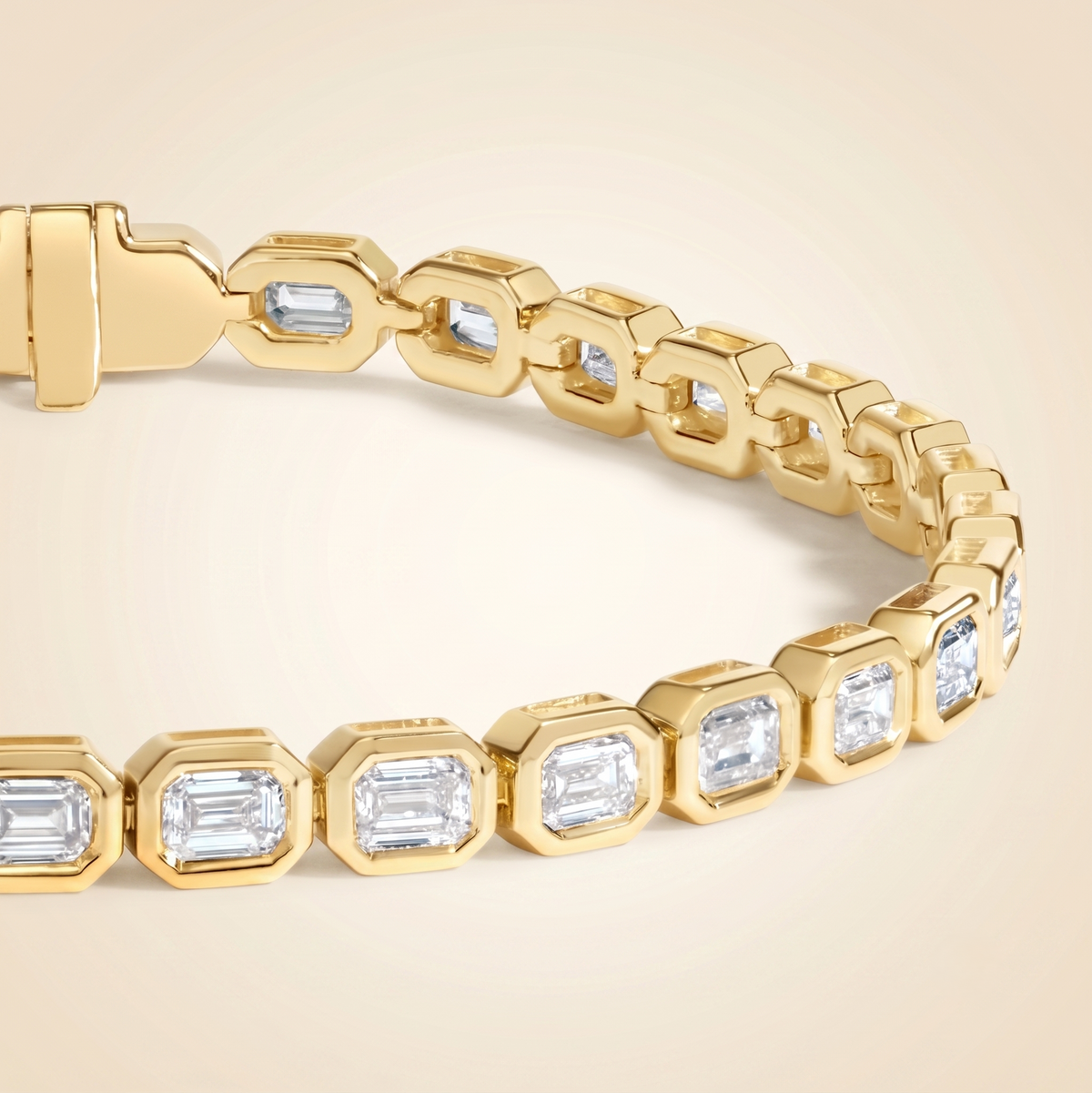 bezel-set emerald cut diamond tennis bracelet in gold