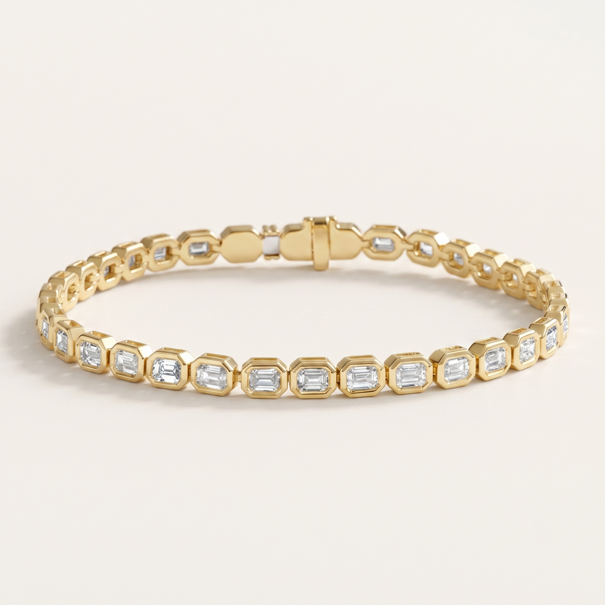 bezel-set emerald cut diamond tennis bracelet in gold