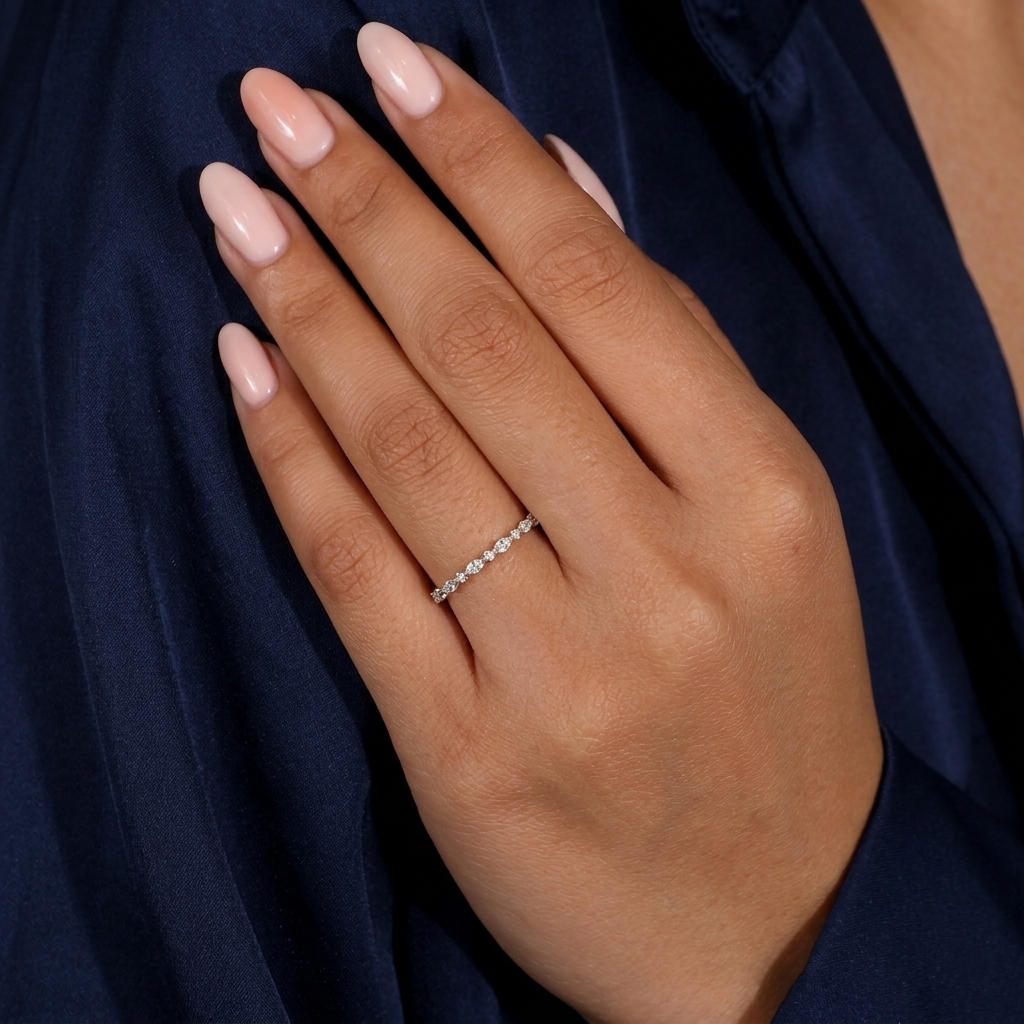alternating marquise and round half eternity diamond band