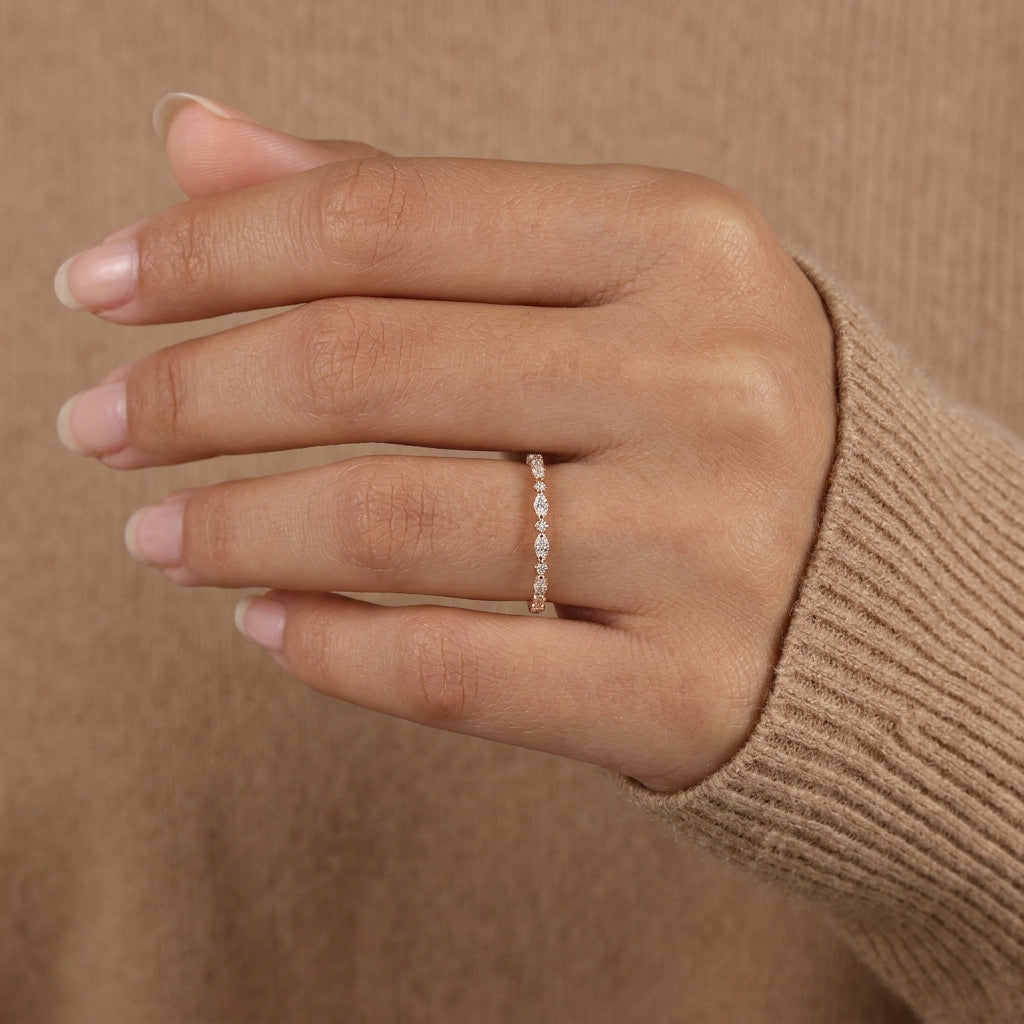 alternating marquise and round half eternity diamond band