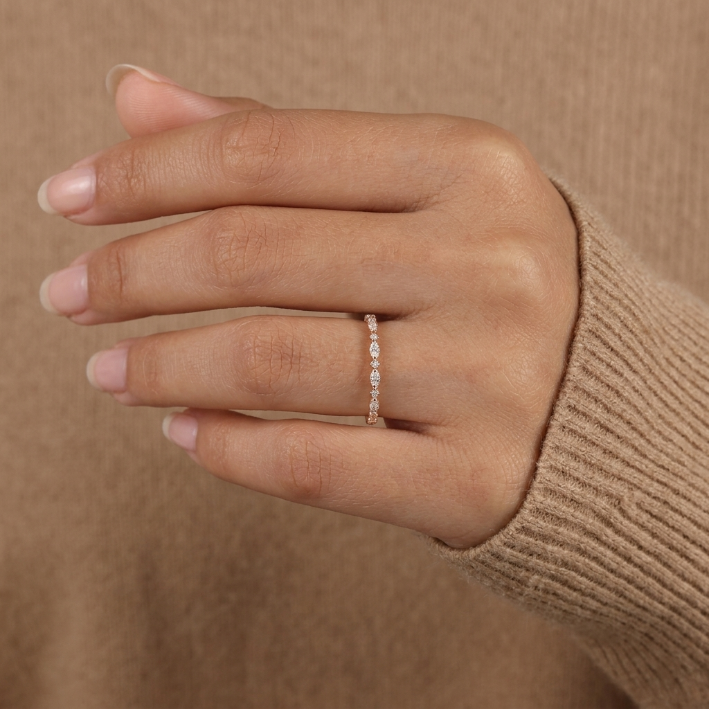 alternating marquise and round half eternity diamond band