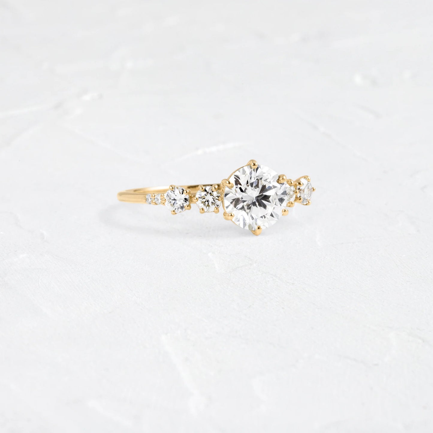 round lab grown diamond side stone engagement ring