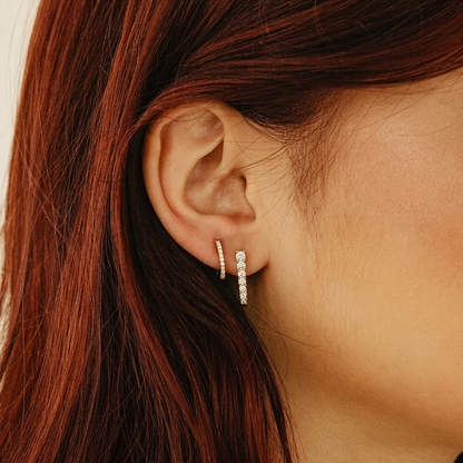 Gold Shared-Prong Round Diamond Oval Huggie Hoop Earrings