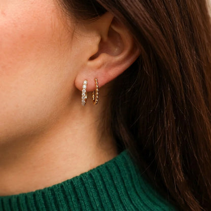 Gold Shared-Prong Round Diamond Oval Huggie Hoop Earrings