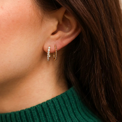 Gold Shared-Prong Round Diamond Oval Huggie Hoop Earrings