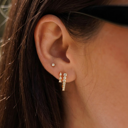 Gold Shared-Prong Round Diamond Oval Huggie Hoop Earrings