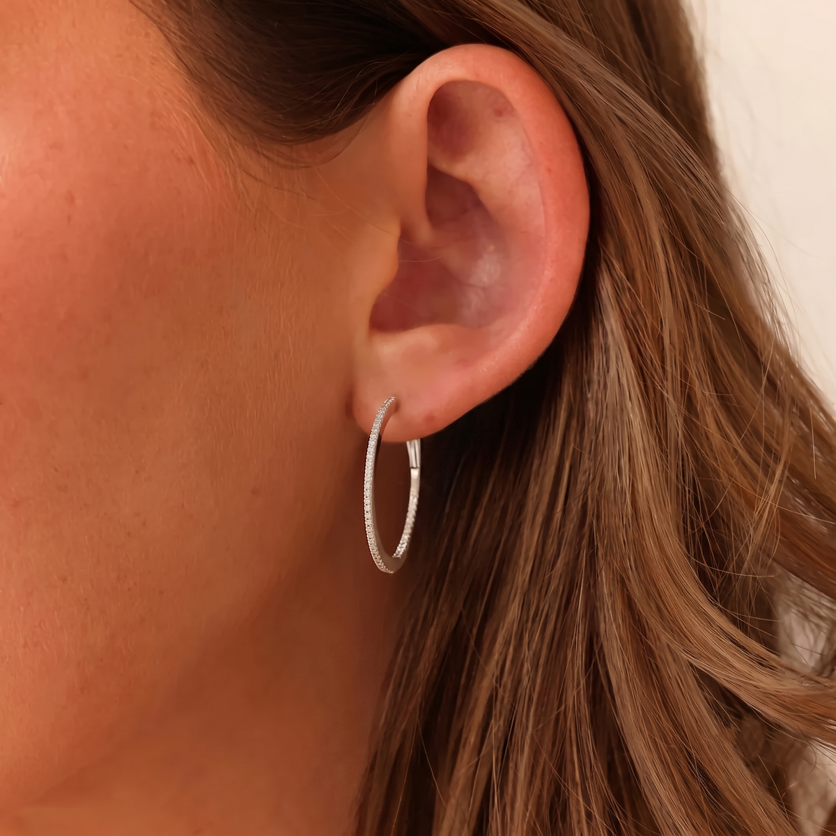 gold inside-out pavé diamond oval hoop earrings