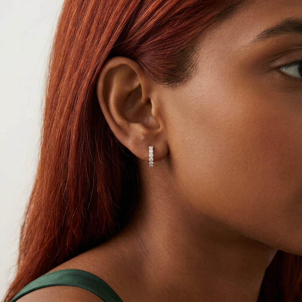 shared-prong round diamond huggie hoop earrings