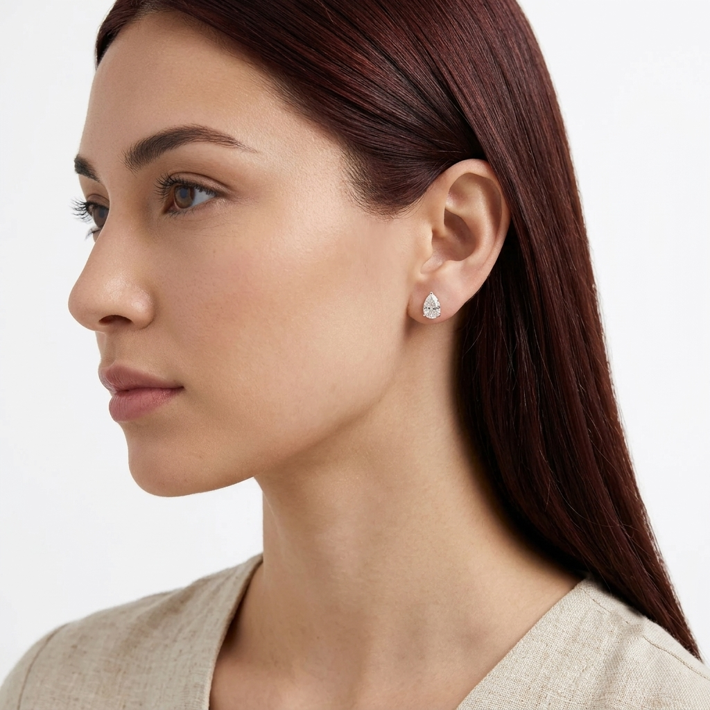 three-prong pear cut diamond stud earrings
