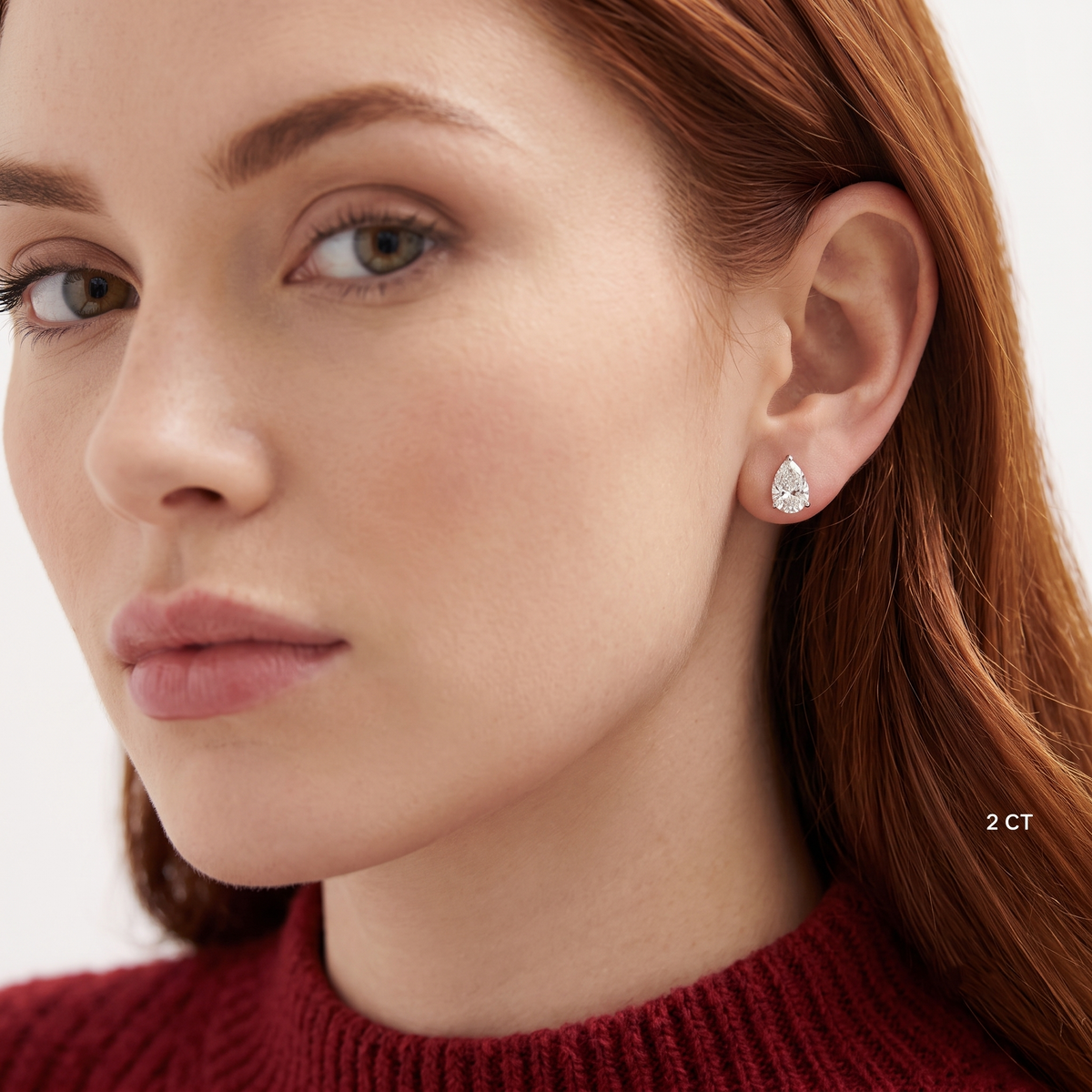 three-prong pear cut diamond stud earrings
