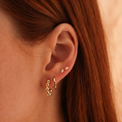 Gold Beaded Huggie Hoop Earrings with Polished Sphere Details
