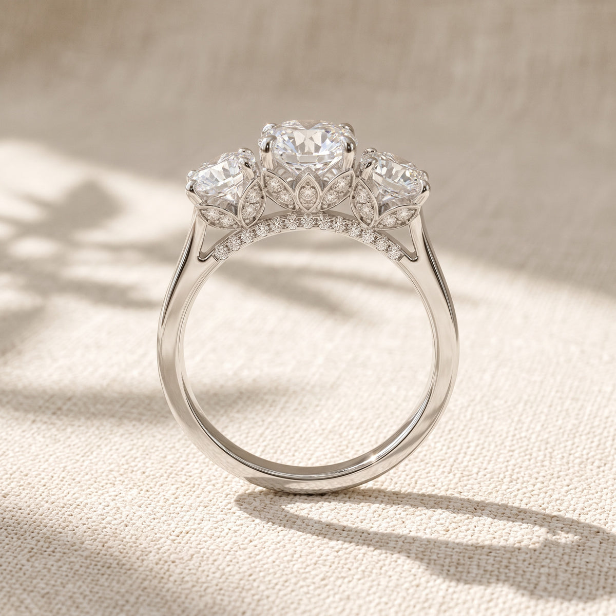 round lab grown diamond three stone engagement ring