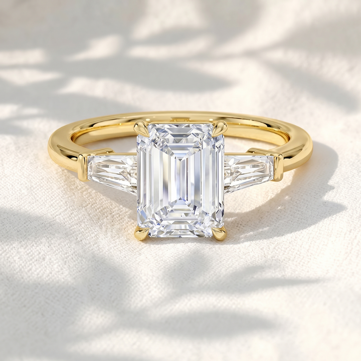 Emerald Cut Lab Grown Diamond Three Stone Engagement Ring with Tapered Baguette Side Stones