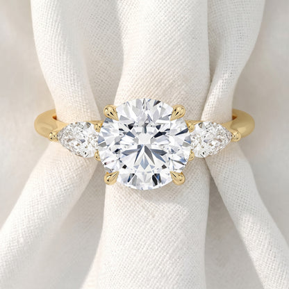 Round Lab Grown Diamond Three Stone Engagement Ring with Pear Side Stones