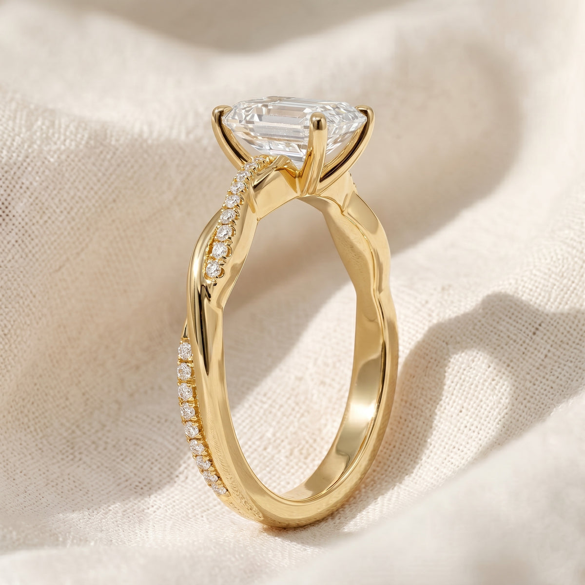 twisted band emerald lab grown diamond engagement ring in gold – pavé crossover ring