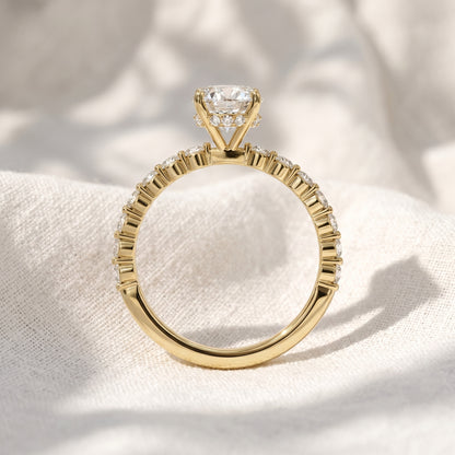 Oval Lab Grown Diamond Hidden Halo Engagement Ring with Shared Prong Pavé Band