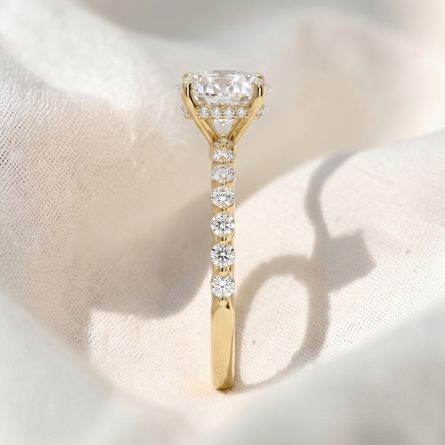 oval lab grown diamond hidden halo engagement ring with shared prong pavé band