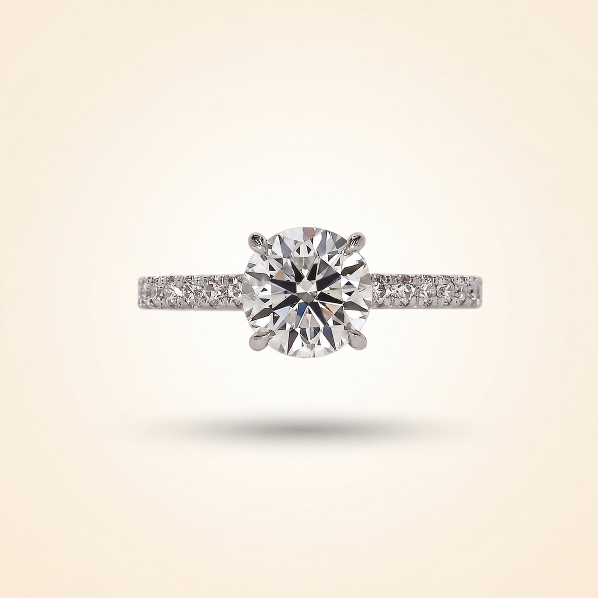 round cut diamond engagement ring with pave band and hidden halo