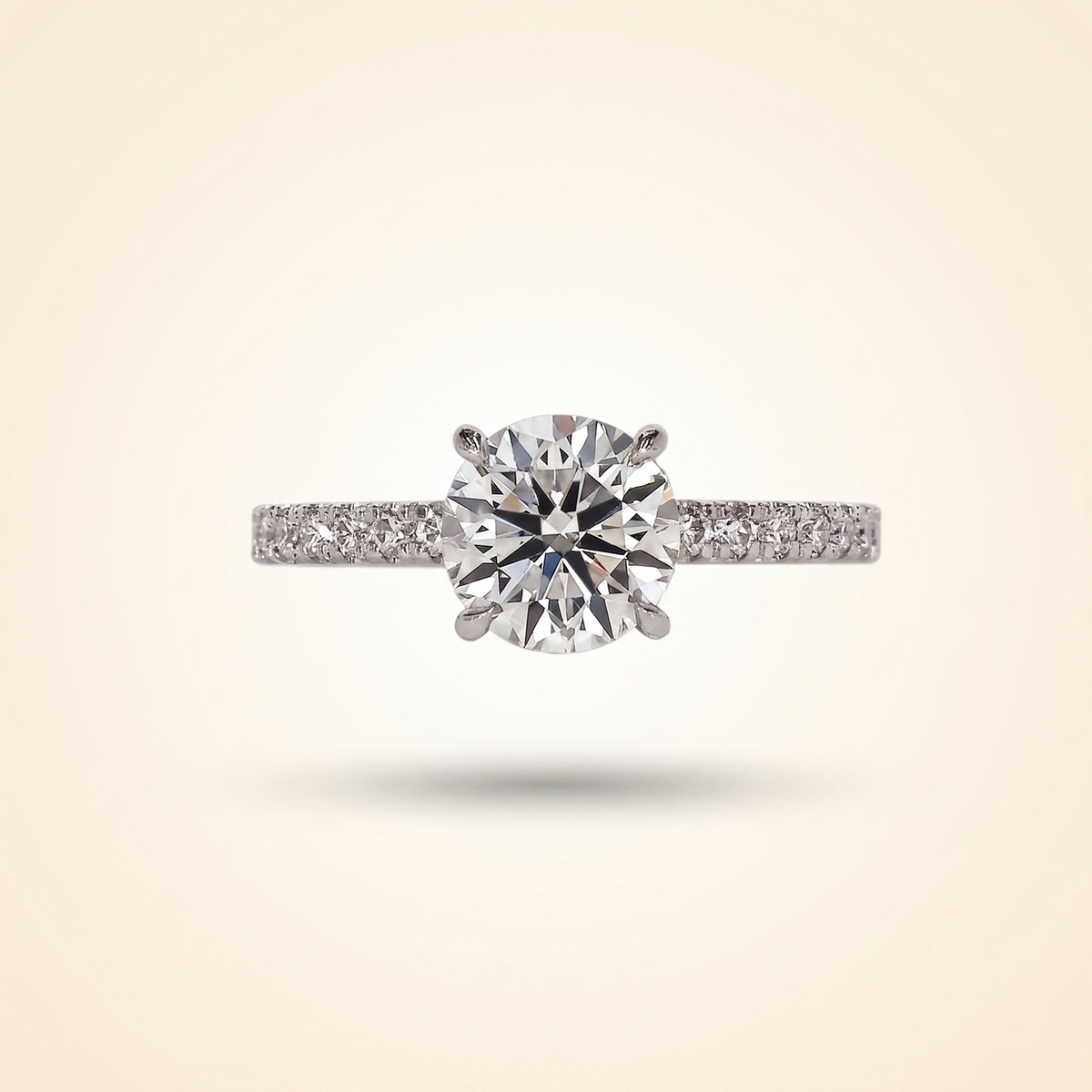 round cut diamond engagement ring with pave band and hidden halo