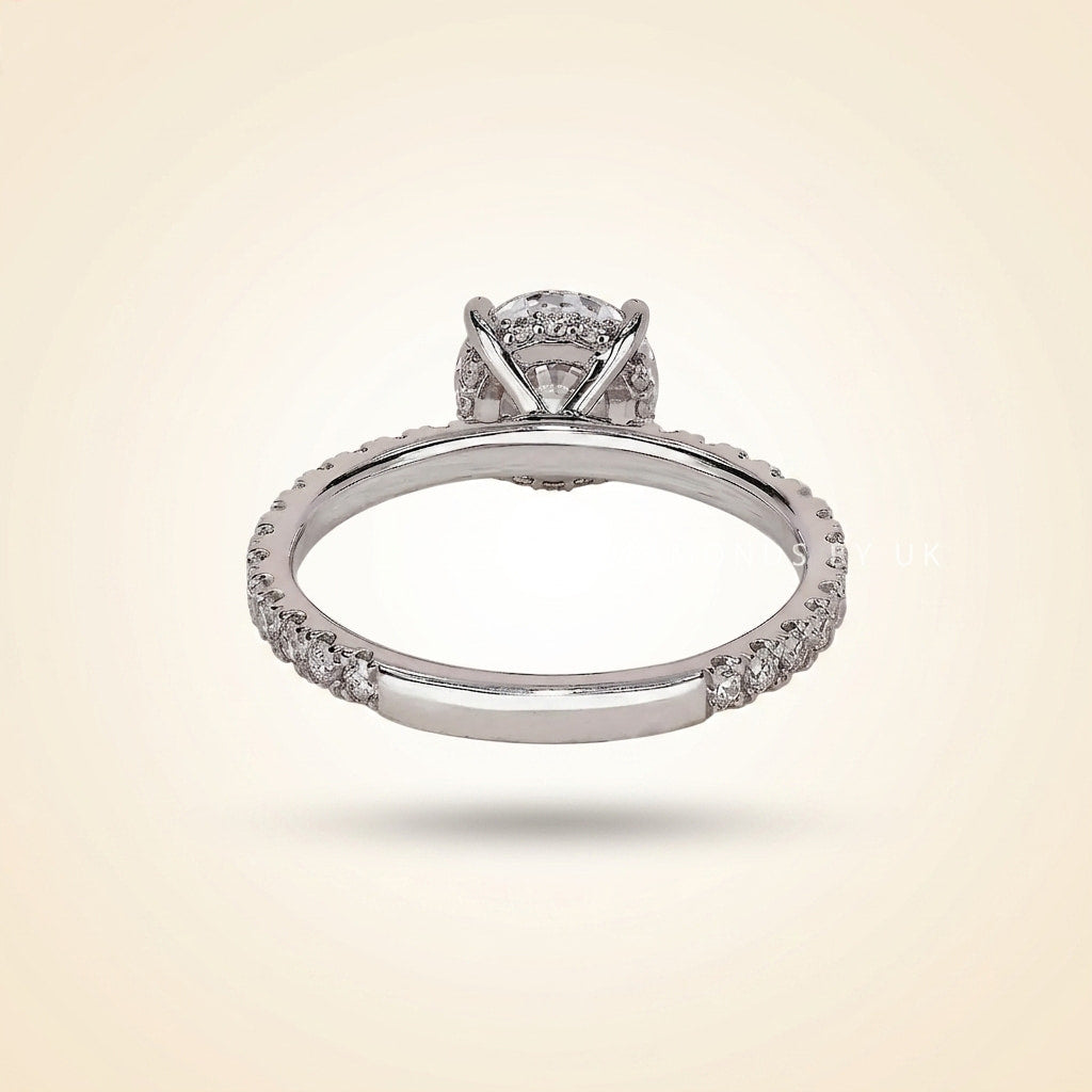 round cut diamond engagement ring with pave band and hidden halo