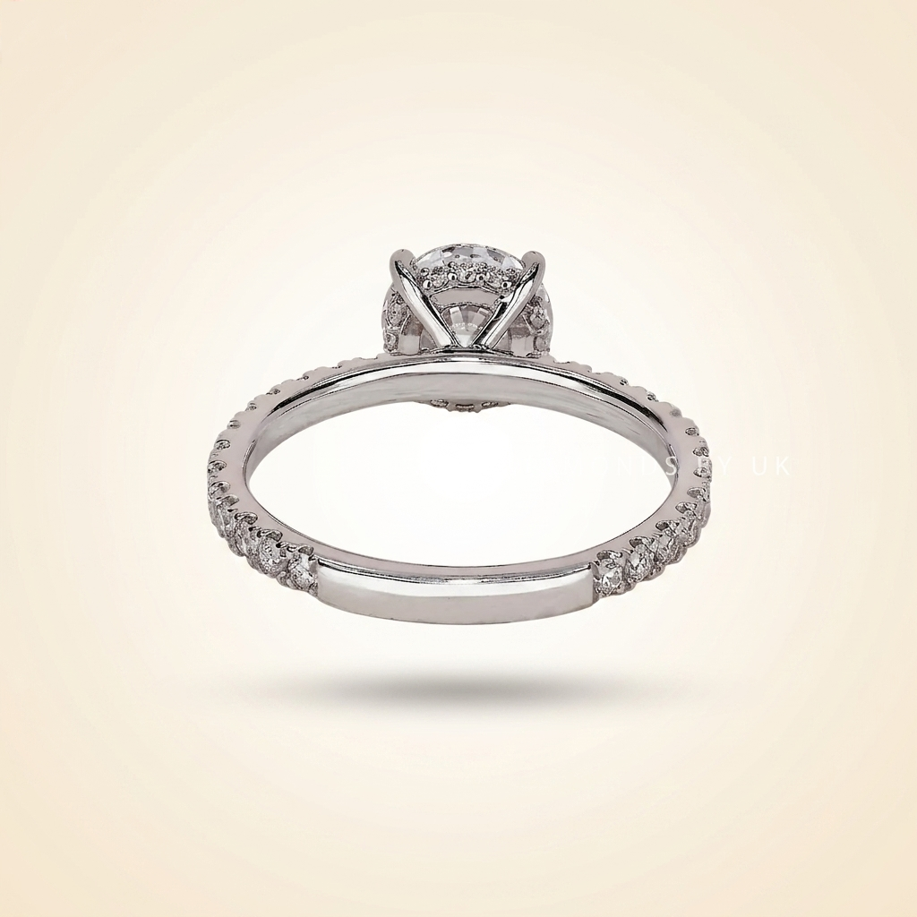 round cut diamond engagement ring with pave band and hidden halo