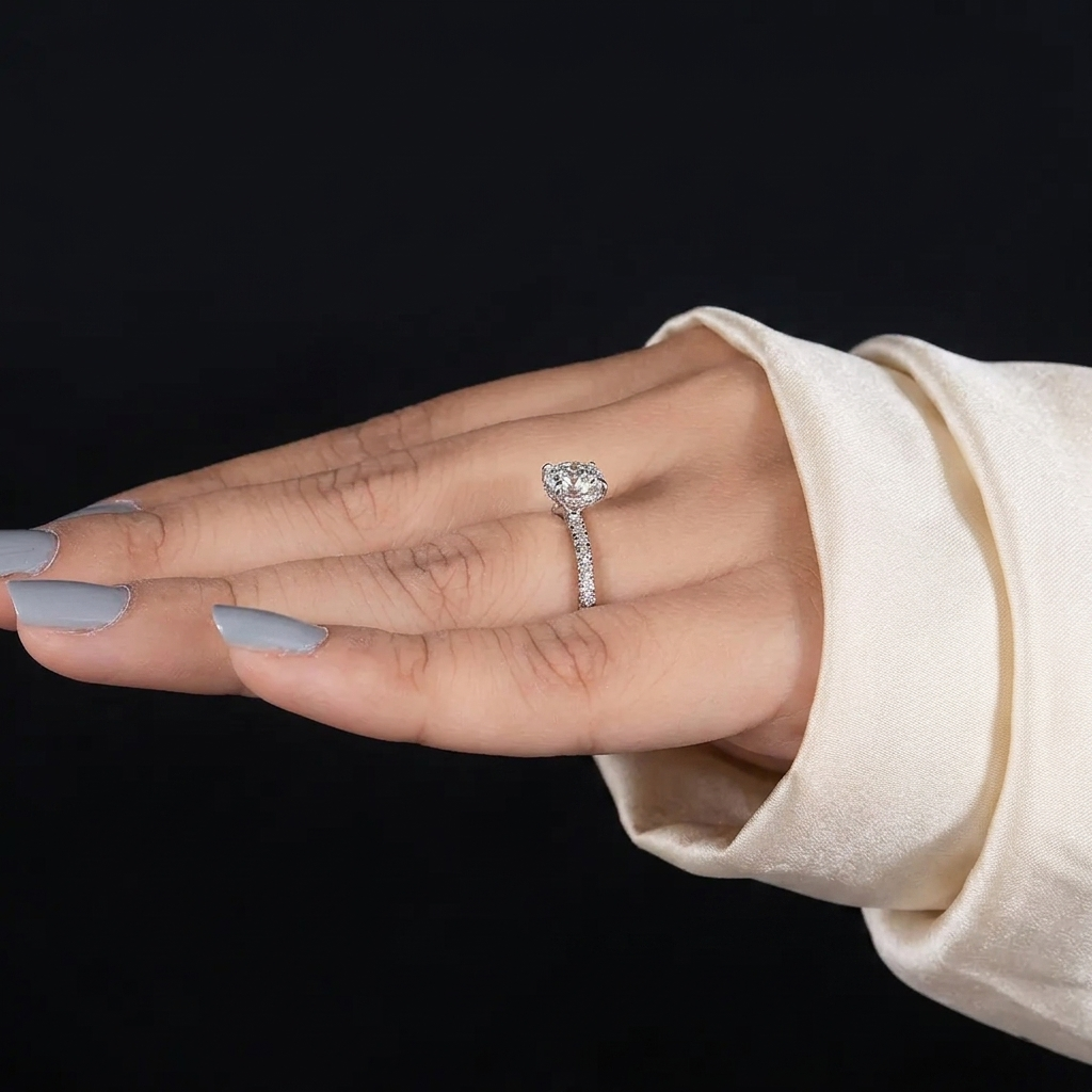 round cut diamond engagement ring with pave band and hidden halo