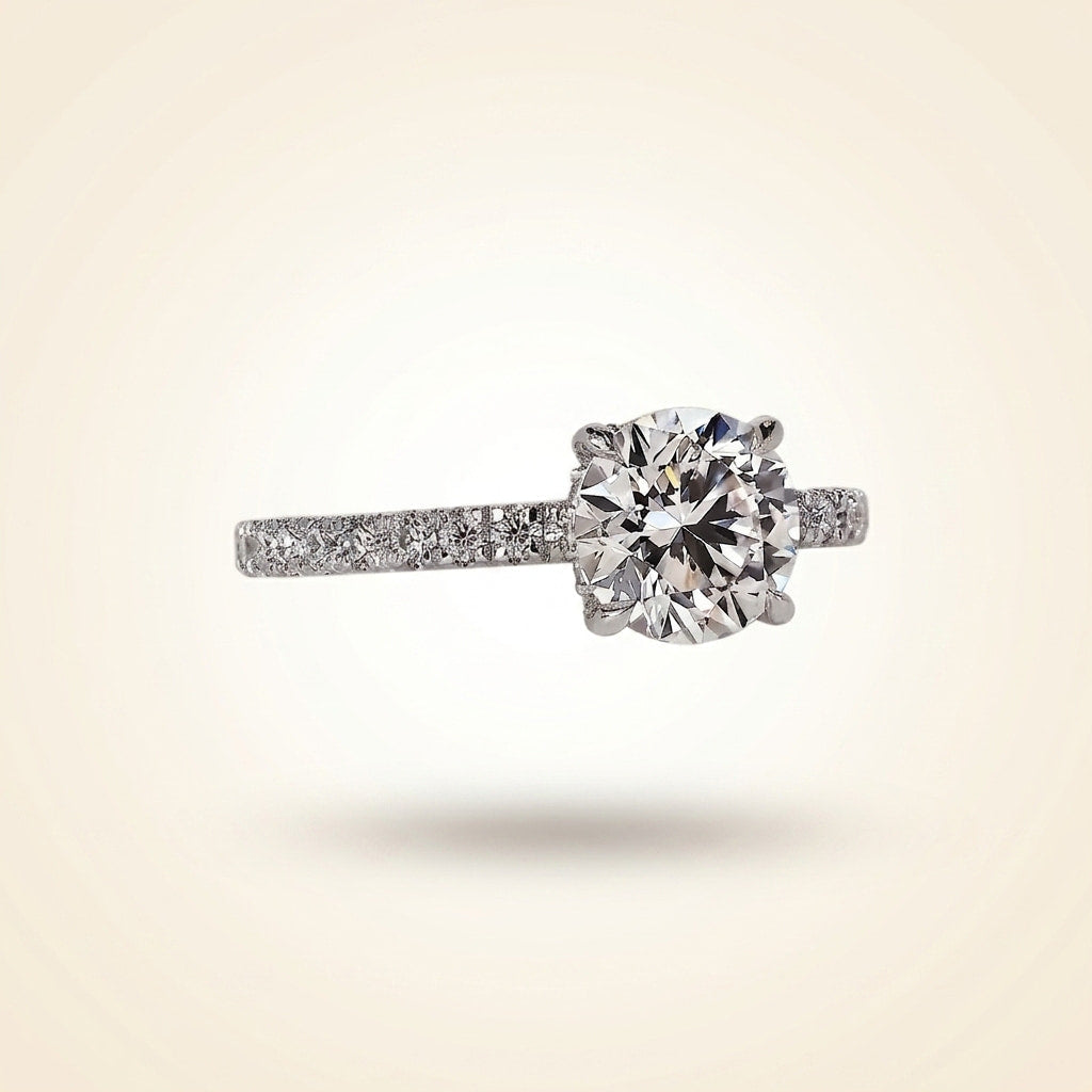 round cut diamond engagement ring with pave band and hidden halo