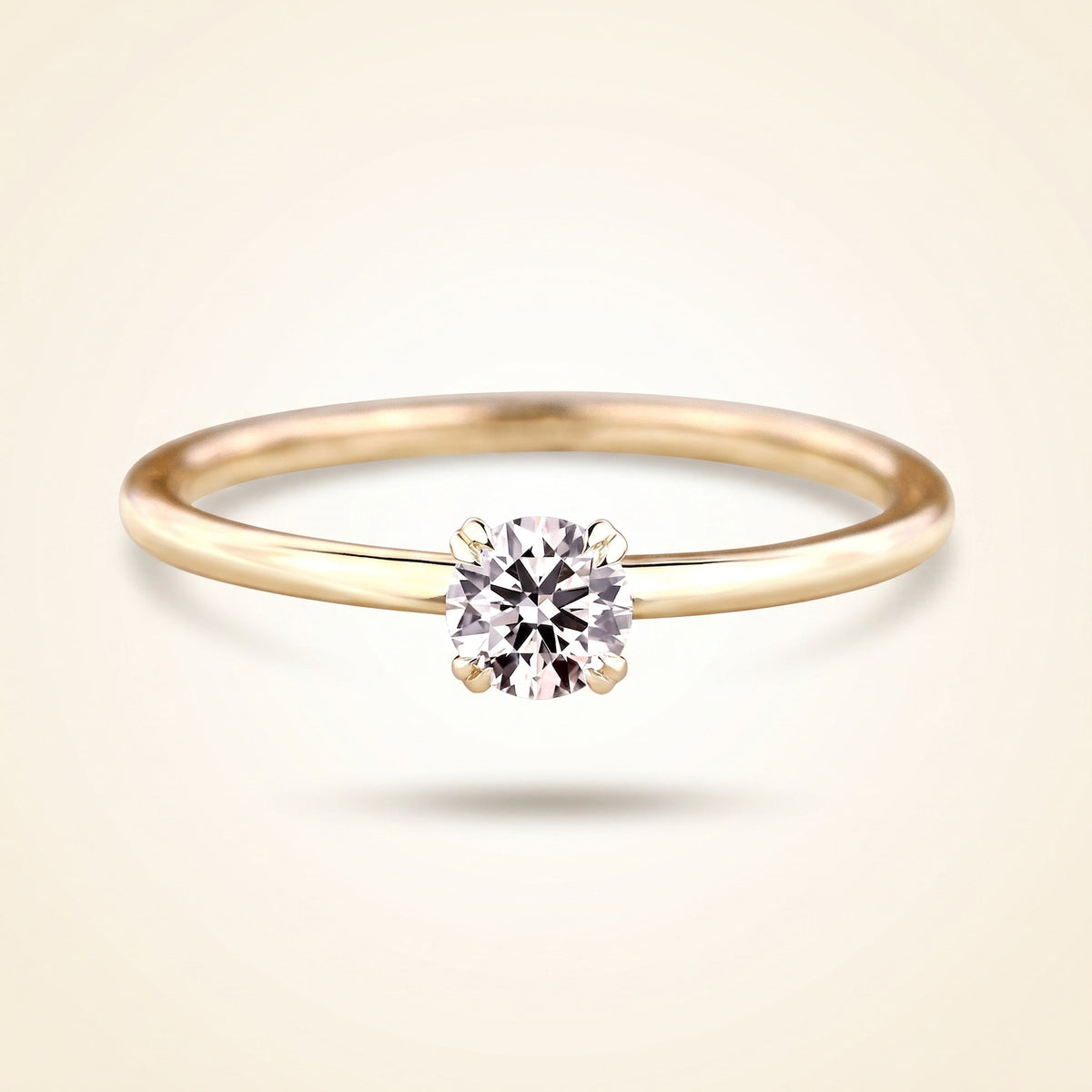 round cut diamond solitaire engagement ring with dainty plain band
