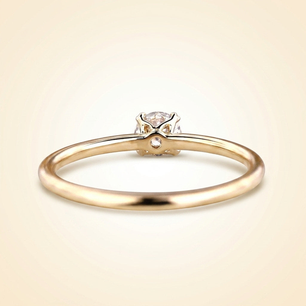 round cut diamond solitaire engagement ring with dainty plain band